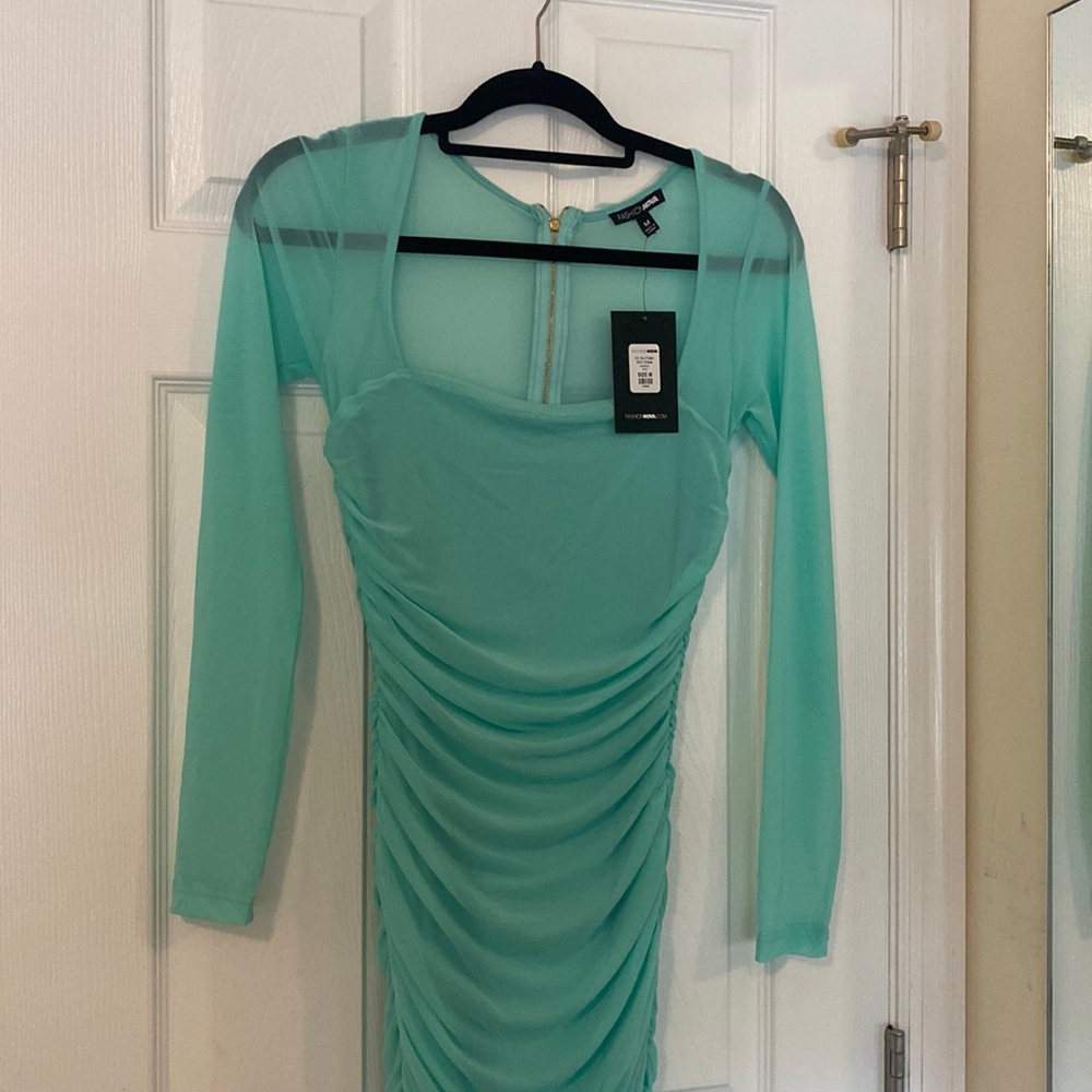 Blue going out dress. Mesh top. Never worn. Size medium